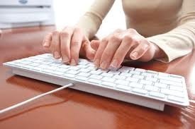 Woman typing on keyboard